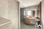 Discover a modern bathroom design with a sleek shower and elegant vanity.