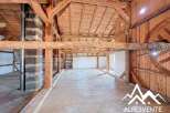 Discover the charm of this unique property featuring exposed wooden beams and a spacious interior.