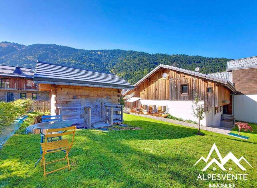 Discover a charming chalet nestled in a picturesque mountain setting.