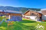 Discover a charming chalet nestled in a picturesque mountain setting.