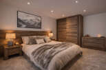 Experience the epitome of rustic elegance in this stunning bedroom.