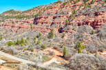 Explore the stunning natural beauty of this property, nestled against a backdrop of majestic red rock formations.