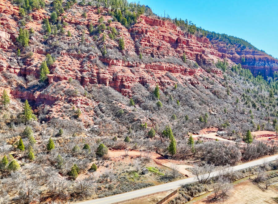 Explore the stunning natural beauty of this property, nestled against a backdrop of majestic red rock formations.
