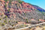 Explore the stunning natural beauty of this property, nestled against a backdrop of majestic red rock formations.
