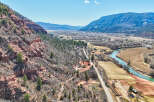Explore the breathtaking beauty of this stunning property nestled amidst majestic mountains and a serene river.