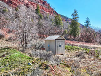 Nestled in a scenic landscape, this property offers a unique blend of natural beauty and functional amenities.