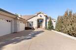 This stunning property boasts a grand entrance with a spacious driveway, perfect for welcoming guests.