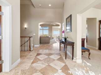 Step into luxury with this stunning entryway, showcasing a beautiful blend of elegance and comfort.