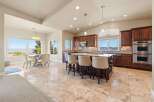 This stunning kitchen boasts a spacious layout with an island, perfect for entertaining.