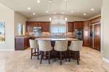 This stunning kitchen boasts rich wood cabinetry, creating a warm and inviting atmosphere.