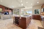 This stunning property boasts a spacious kitchen with a large island, perfect for culinary enthusiasts and entertaining guests.
