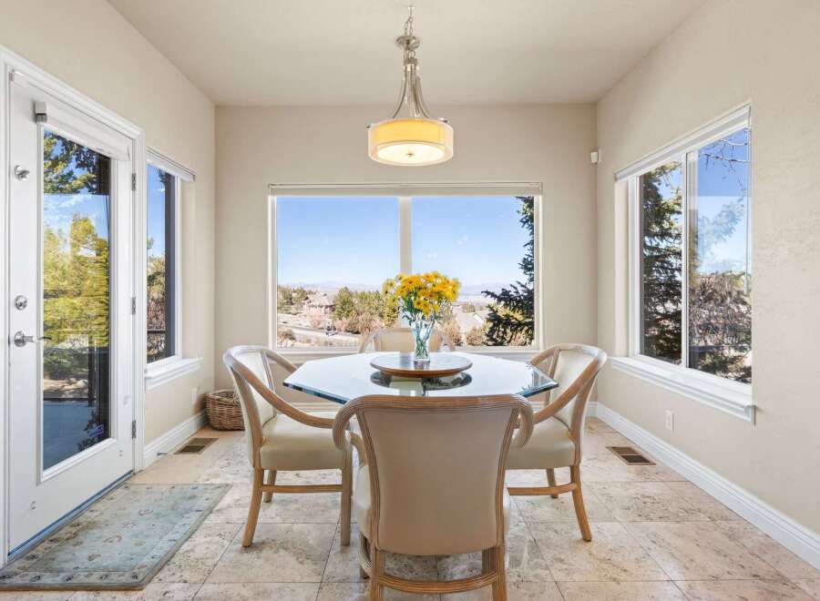 Enjoy breathtaking views from this elegant dining room.