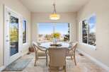Enjoy breathtaking views from this elegant dining room.