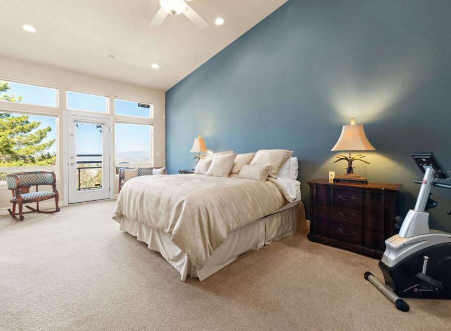 This stunning bedroom offers a serene retreat with its spacious layout and elegant design.