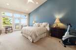 This stunning bedroom offers a serene retreat with its spacious layout and elegant design.