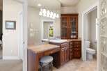 Step into luxury with this stunning bathroom featuring a custom vanity and elegant cabinetry.