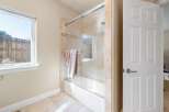 Step into a beautifully designed bathroom featuring a modern glass shower enclosure.