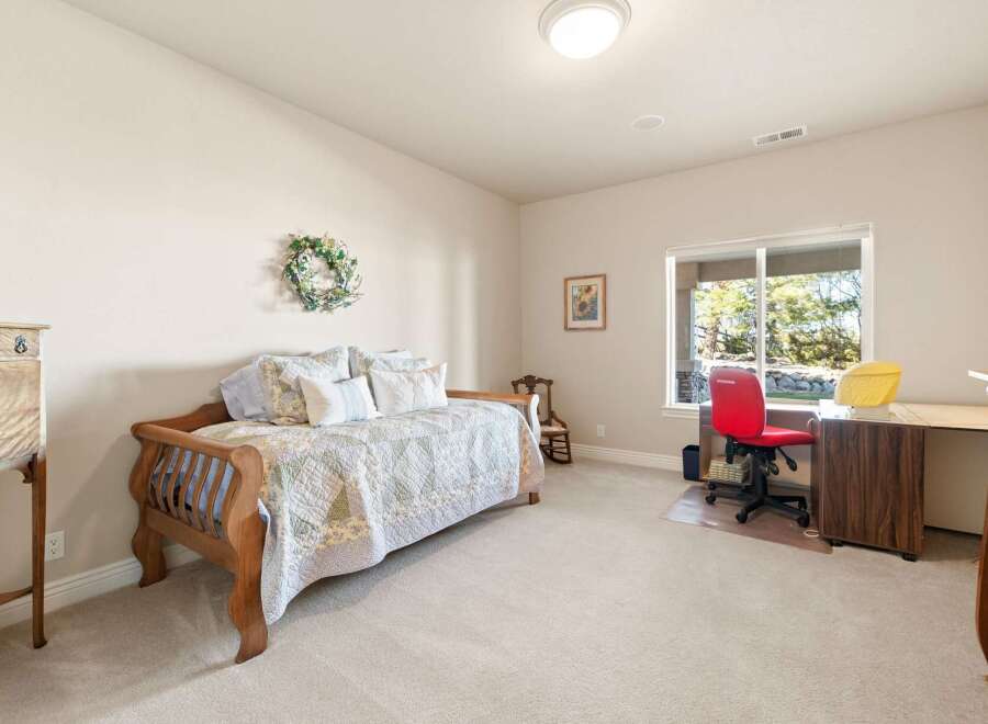 This charming bedroom offers a cozy and inviting atmosphere, perfect for relaxation.