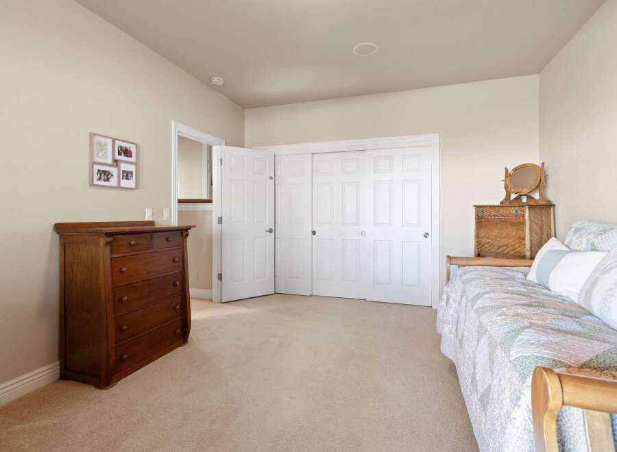 Discover the charm of this inviting bedroom, featuring a warm and inviting atmosphere.