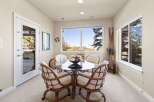 This dining area offers a bright and inviting space for meals and gatherings.
