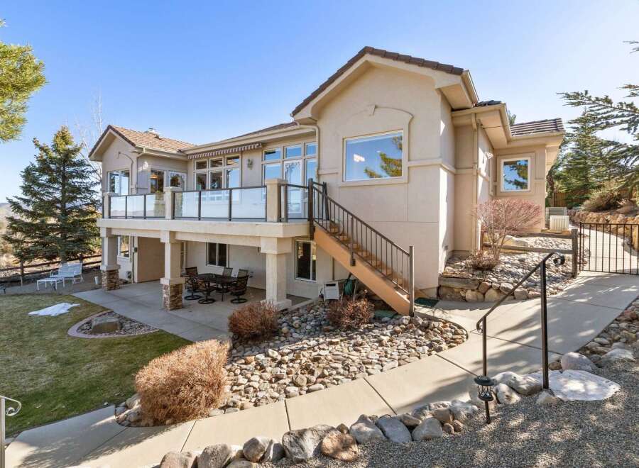 This stunning property boasts a beautiful exterior with a spacious deck, perfect for enjoying the outdoors.