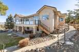 This stunning property boasts a beautiful exterior with a spacious deck, perfect for enjoying the outdoors.