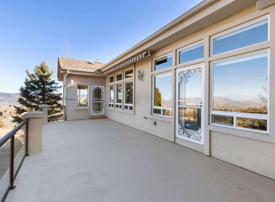 Enjoy breathtaking views from this stunning property! This home features a spacious outdoor deck, perfect for entertaining or relaxing.