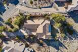 This stunning property boasts a modern design with a beautiful roof and a spacious driveway.