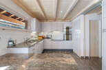 Discover the charm of this stunning kitchen, featuring a beautiful granite countertop and modern appliances.