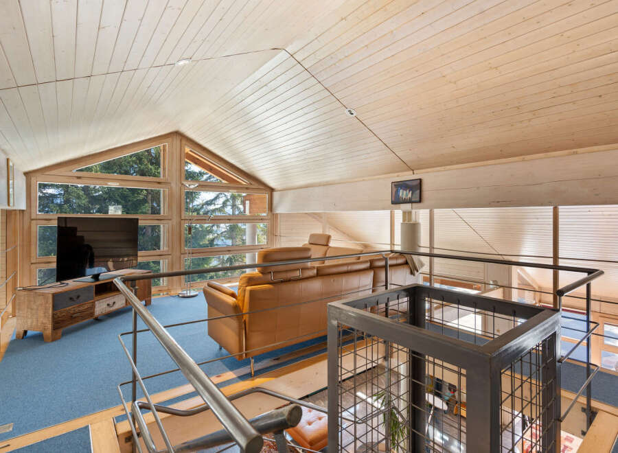 Discover the charm of this stunning property, featuring a spacious living area with a unique architectural design.