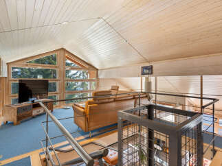 Discover the charm of this stunning property, featuring a spacious living area with a unique architectural design.