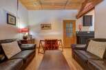Step into this inviting living space, featuring two comfortable leather sofas perfect for relaxation.