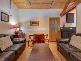 Step into this inviting living space, featuring two comfortable leather sofas perfect for relaxation.