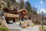 Nestled in a picturesque mountain setting, this stunning chalet offers a perfect blend of rustic charm and modern luxury.