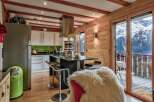 Experience luxury living in this stunning kitchen with breathtaking mountain views.