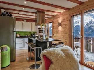 Experience luxury living in this stunning kitchen with breathtaking mountain views.