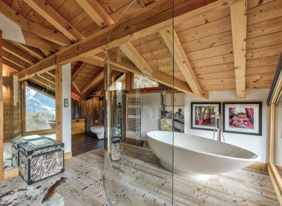 This stunning bathroom showcases a unique blend of rustic charm and modern luxury.