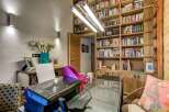 Discover the perfect home office setup in this stunning property! Featuring a built-in bookshelf, a sleek glass desk, and a modern printer, this space is designed for productivity and style.