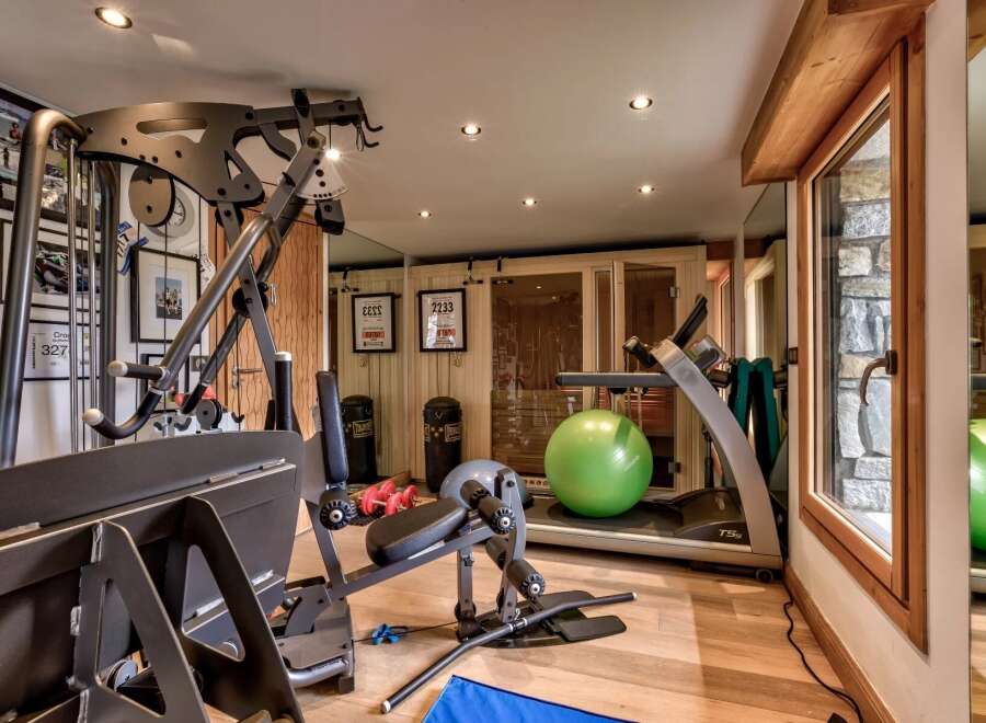 This stunning home gym offers a comprehensive workout experience with state-of-the-art equipment.
