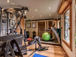 This stunning home gym offers a comprehensive workout experience with state-of-the-art equipment.