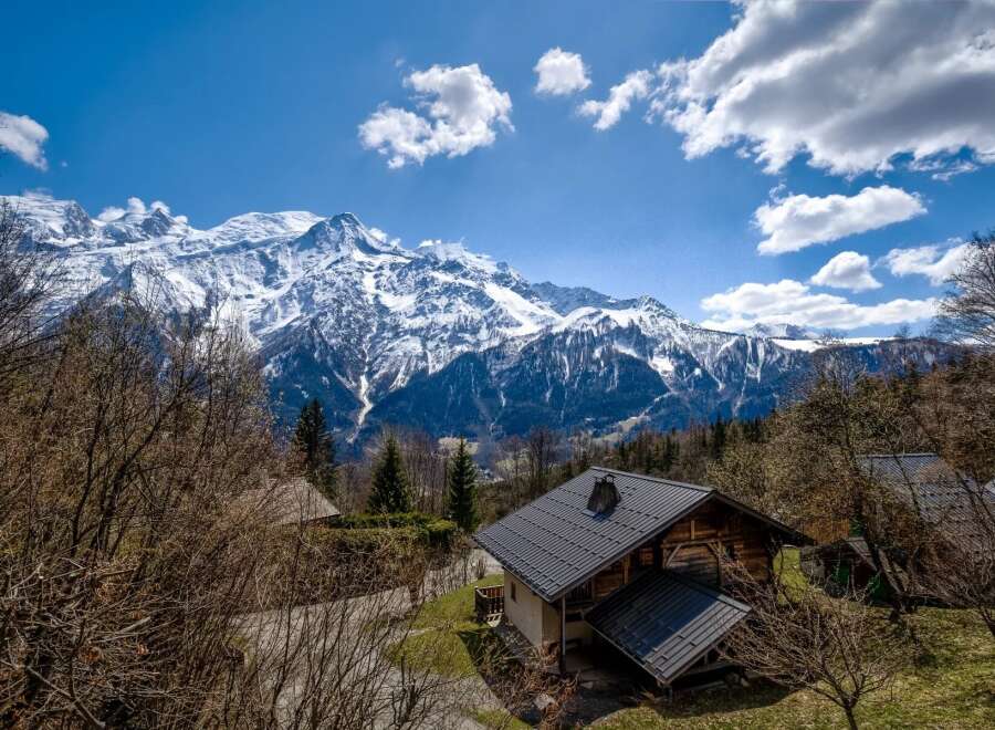 Nestled amidst the majestic snow-capped mountains, this charming chalet offers breathtaking views and a serene escape.