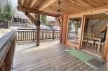 Discover the charm of this stunning property, featuring a spacious wooden deck perfect for enjoying the outdoors.