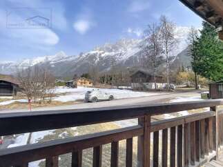 Experience breathtaking mountain views from this charming property.