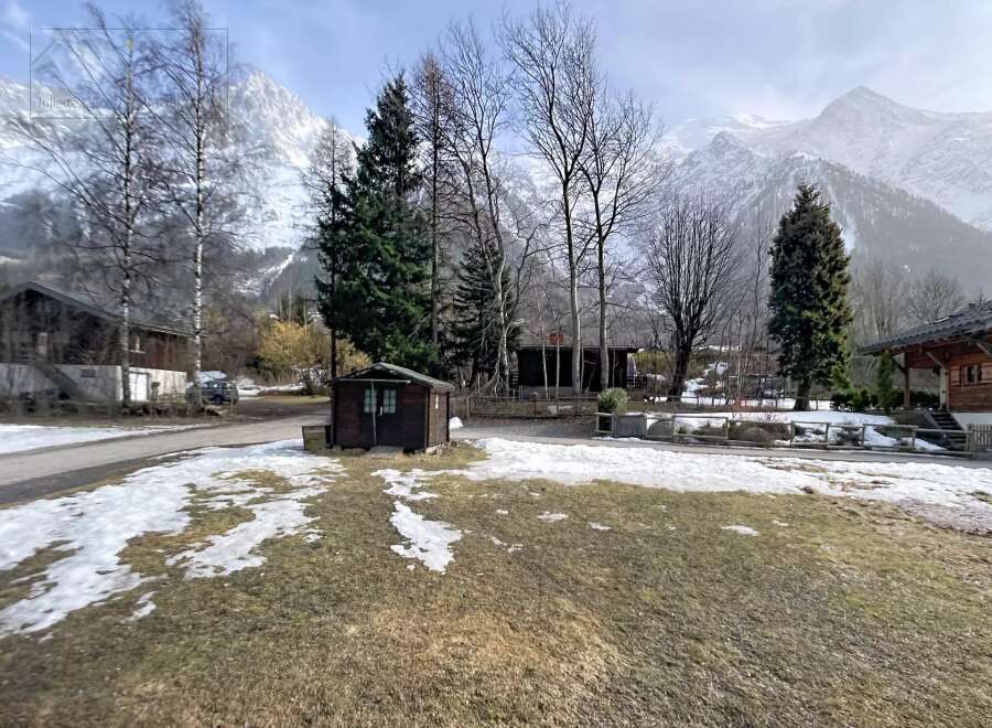 Nestled in a picturesque mountain setting, this property offers a serene escape.