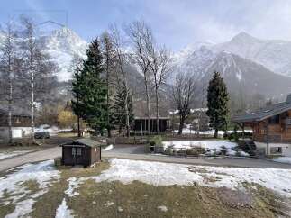 Discover a charming property nestled in a picturesque mountain setting.