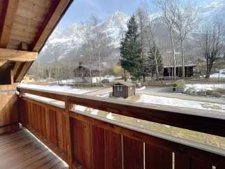 Enjoy breathtaking mountain views from this charming property.