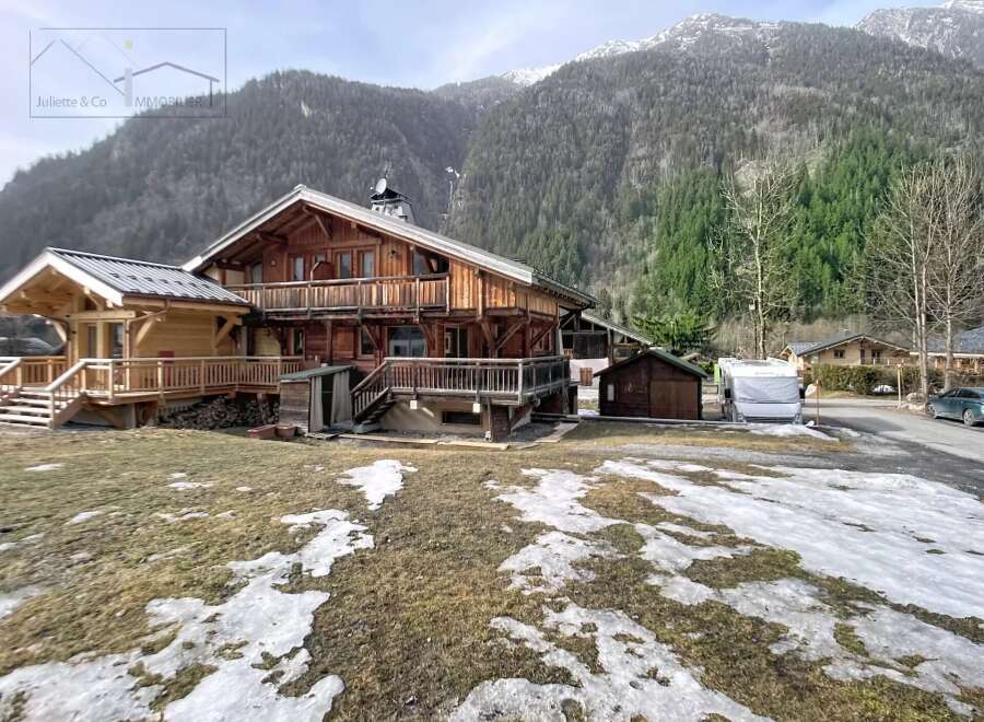 Discover this stunning wooden chalet nestled in a picturesque mountain setting.