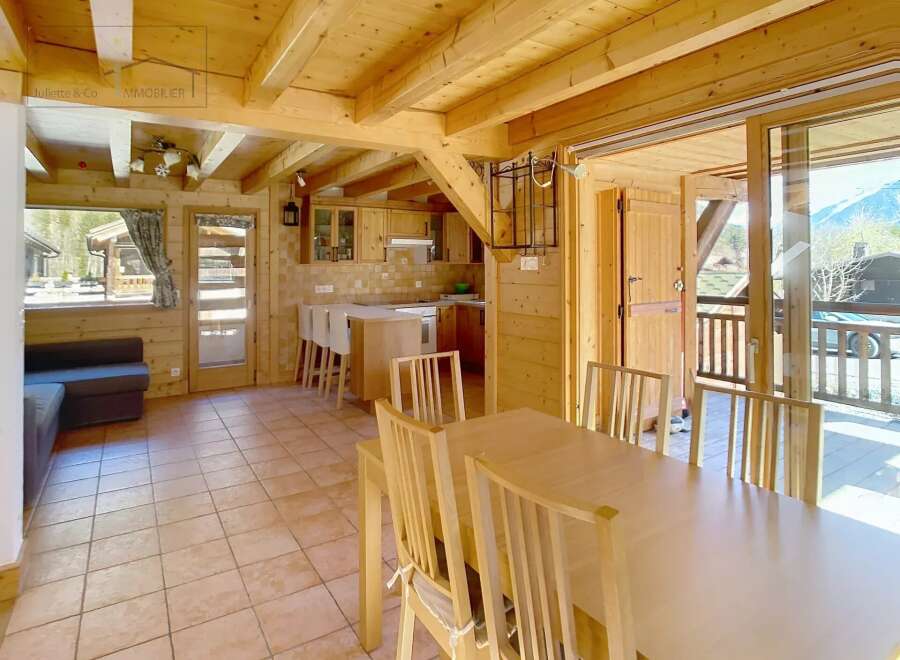 Discover the charm of this stunning property, featuring a warm and inviting interior with beautiful wooden accents throughout.