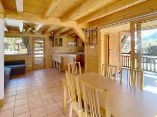 Discover the charm of this stunning property, featuring a warm and inviting interior with beautiful wooden accents throughout.
