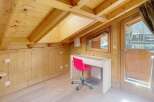Discover the charm of this cozy attic space, perfect for a home office or a relaxing retreat.